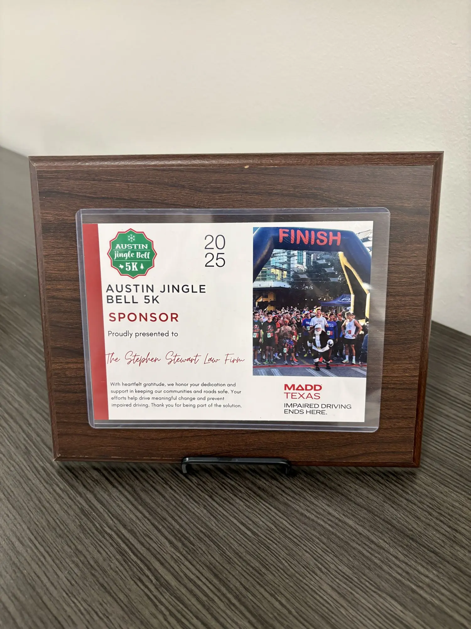 MADD Texas appreciation plaque recognizing The Stewart Law Firm as 2025 Austin Jingle Bell 5K sponsor